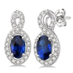 Load image into Gallery viewer, 5x3 MM Oval Cut Sapphire and 1/5 Ctw Round Cut Diamond Earrings in 10K White Gold