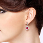 Load image into Gallery viewer, 5x3 MM Hanging Arm Oval Cut Ruby and 1/6 Ctw Round Cut Diamond Precious Earring in 10K White Gold
