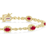 Load image into Gallery viewer, 5x3 MM Oval Cut Ruby and 1/20 Ctw Round Cut Diamond Bracelet in 10K Yellow Gold