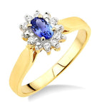 Load image into Gallery viewer, 5x3mm Oval Cut Tanzanite and 1/10 Ctw Round Cut Diamond Ring in 10K Yellow Gold
