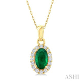 5x3 MM Oval Shape Emerald and 1/20 Ctw Single Cut Diamond Halo Precious Pendant with Chain in 10K Yellow Gold