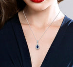 Load image into Gallery viewer, 6x4 MM Oval Cut Sapphire and 1/8 Ctw Round Cut Diamond Pendant in 14K White Gold with Chain