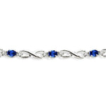Load image into Gallery viewer, 4x3 MM Oval Cut Sapphire and 1/10 Ctw Round Cut Diamond Bracelet in 10K White Gold