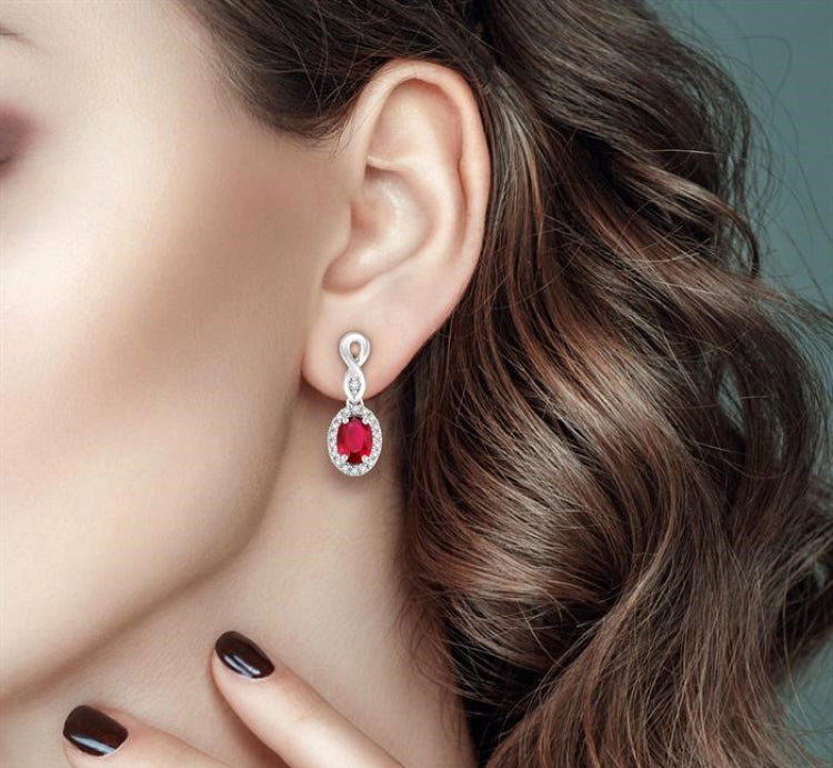 5x3 MM Oval Cut Ruby and 1/6 Ctw Round Cut Diamond Earrings in 14K White Gold