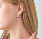 Load image into Gallery viewer, 5x3 MM Oval Cut Ruby and 1/5 Ctw Round Cut Diamond Earrings in 10K White Gold