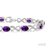 1/10 Ctw Round Cut Diamond & 7x5 MM Oval Cut Amethyst Semi Precious Infinity Bracelet in Sterling Silver