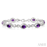 1/10 Ctw Round Cut Diamond & 7x5 MM Oval Cut Amethyst Semi Precious Bracelet in Sterling Silver