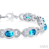 1/10 ctw Oval Shape 7x5 MM Blue Topaz and Round Cut Diamond Semi Precious Bracelet in Sterling Silver