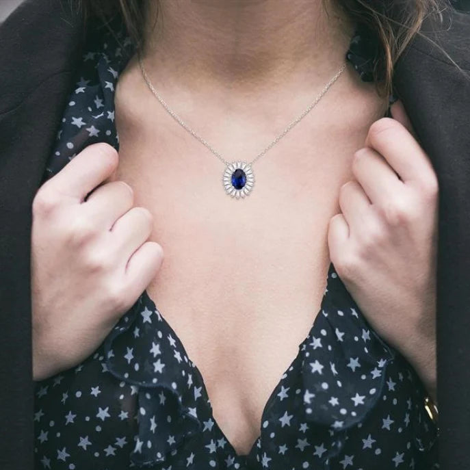 1/3 Ctw Oval Cut 6X4MM Sapphire and Baguette Cut Diamond Halo Precious Pendant With Chain in 14K White Gold