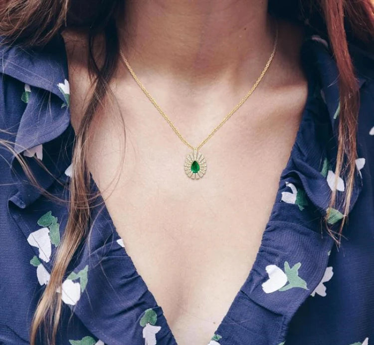 1/3 Ctw Starburst 6X4MM Pear Cut Emerald and Round Cut Diamond Precious Pendant With Chain in 14K Yellow Gold