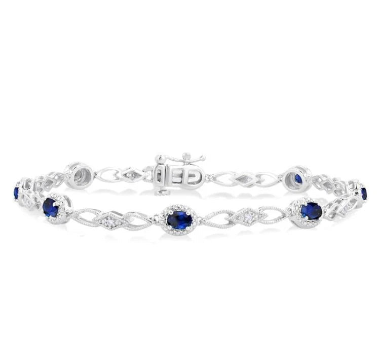 1/20 Ctw Oval Cut 4X3MM Sapphire and Round Cut Diamond Precious Fashion Bracelet in 10K White Gold