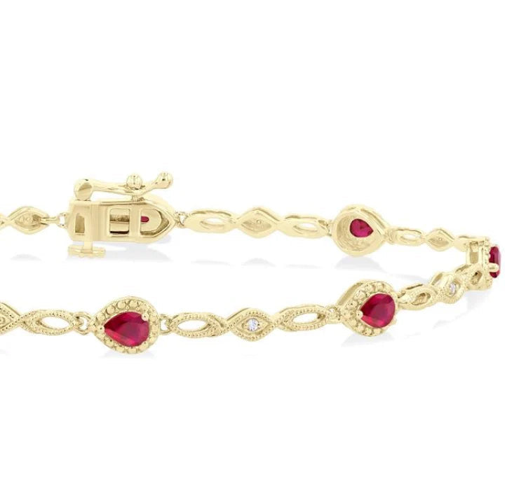 4X3 MM Pear Cut Ruby and 1/20 Ctw Round Cut Diamond Precious Fashion Bracelet in 10K Yellow Gold