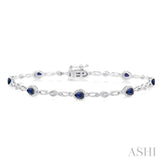 4X3 MM Pear Cut Sapphire and 1/20 Ctw Round Cut Diamond Precious Fashion Bracelet in 10K White Gold