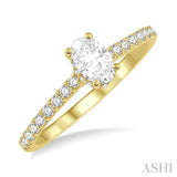 1/2 ctw Round Cut Diamond Engagement Ring With 1/4 ctw Oval Cut Center Stone in 14K Yellow Gold